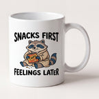 Snacks First Feelings Later Raccoon Funny Mug mug, front view